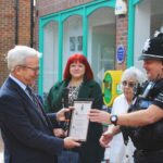 Charles Bishop, High Sherrif of Essex (left) presents the award for outstanding community service to Special Sergeant, Simon Jesse. Nikki Smith, Witham Town Clerk and Hub volunteers look on.