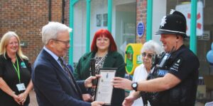 Charles Bishop, High Sherrif of Essex (left) presents the award for outstanding community service to Special Sergeant, Simon Jesse. Nikki Smith, Witham Town Clerk and Hub volunteers look on.